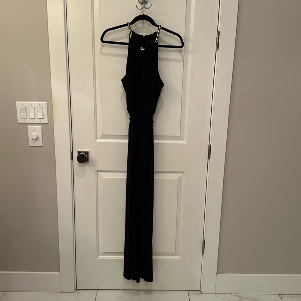 Black wide-legged jumpsuits with gold chained halter top